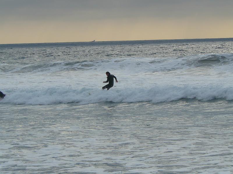 P1070929.JPG - Well, he caught one. This shot was taken just before he turned and jump off the wave to do a 360. It was pretty incredible.
